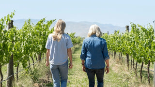 Mother-daughter winemakers Kate and Penelope Radburnd walking through the vineyard at their Hawke's Bay winery