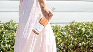 Penelope Radburnd holding the Penelope Rose bottle at their Hawke's Bay cellar door