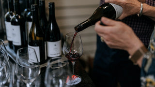 Pouring a glass of Radburnd Cellars red wine during a tasting, Hawke's Bay - part of the Wine Club experience.